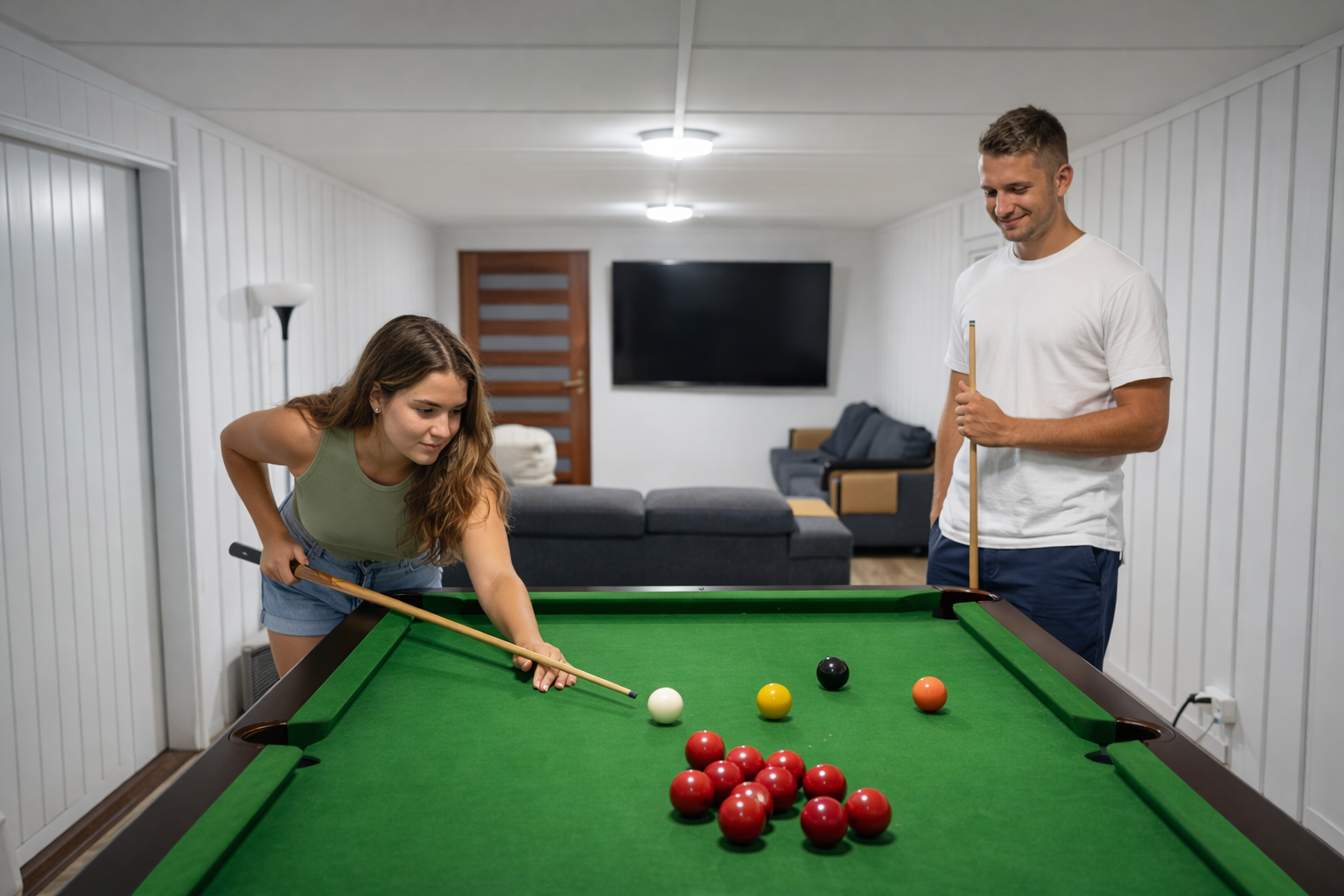 Couple playing snooker