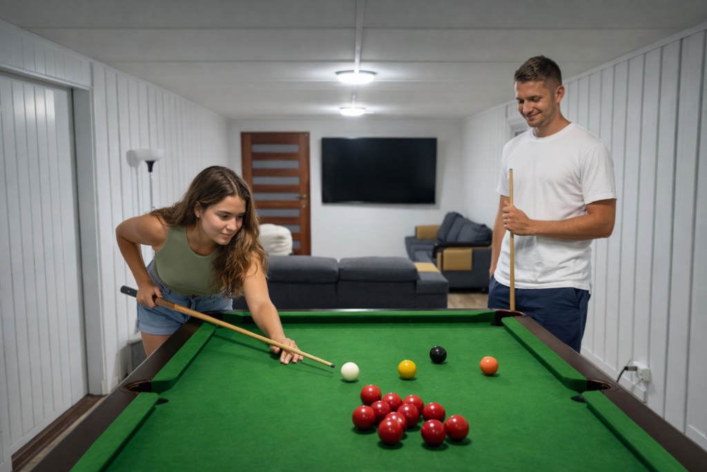 Couple playing snooker