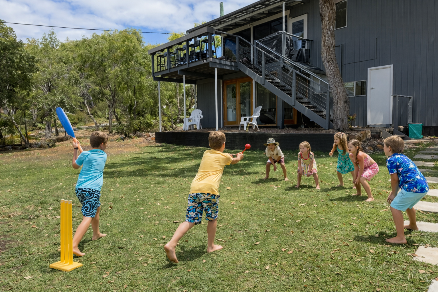 Kids playing cricket while on holiday